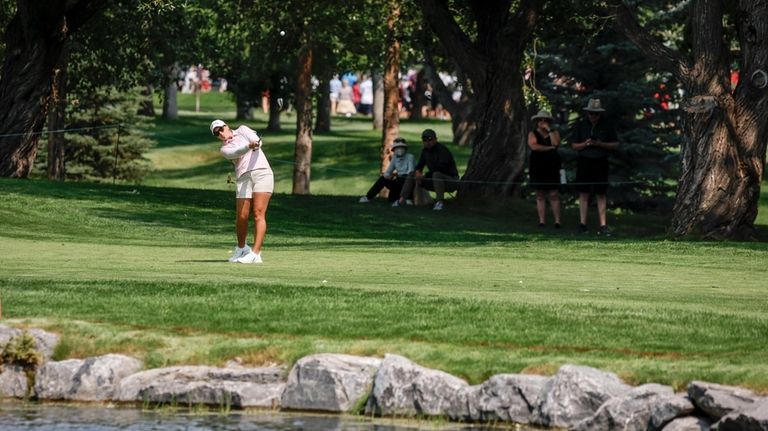 Lauren Coughlin, of the United States, hits from the fairway...