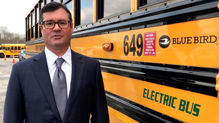 John Corrado, president of Suffolk Transportation Service, which buses students...