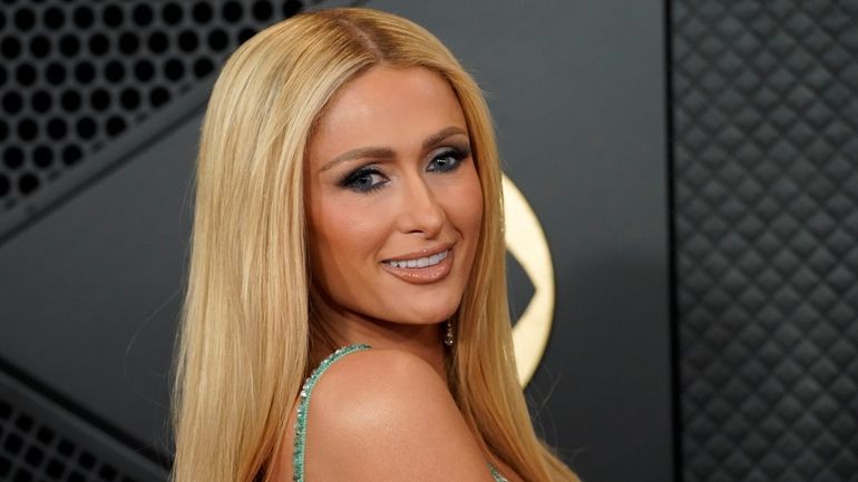 Paris Hilton arrives at the 66th annual Grammy Awards in...