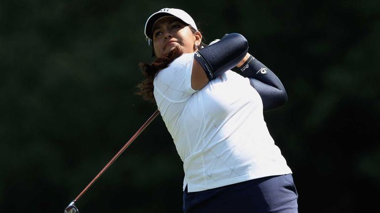 Lizette Salas watches her tee shot on the ninth hole...