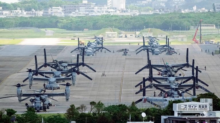 U.S. MV-22B Osprey transport aircraft are parked at the U.S....