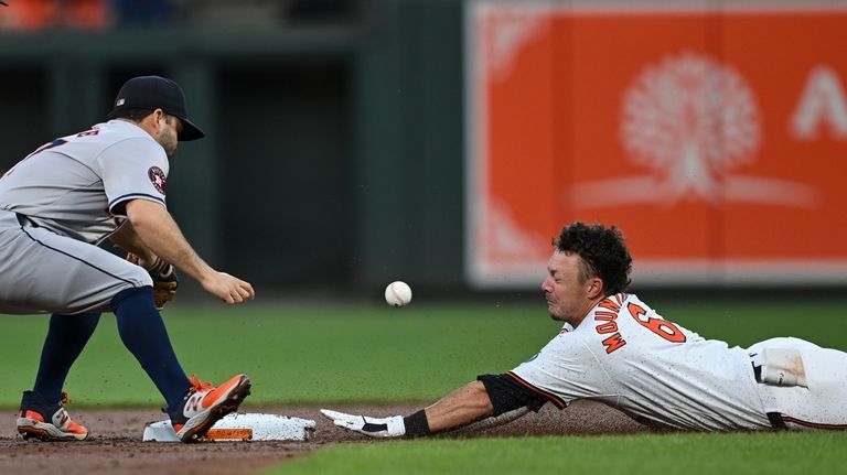 Baltimore Orioles' Ryan Mountcastle slides into second base and avoids...