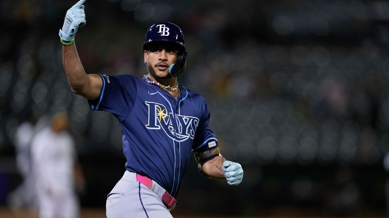 Tampa Bay Rays' Jose Siri reacts after hitting a solo...