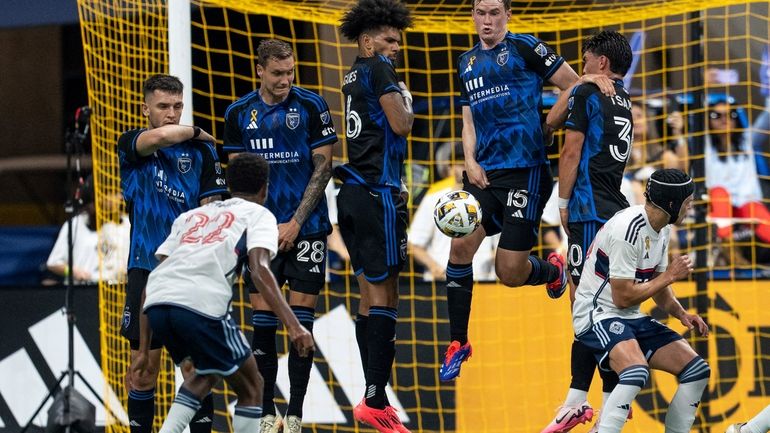 San Jose Earthquakes' Tanner Beason (15) blocks a penalty kick...