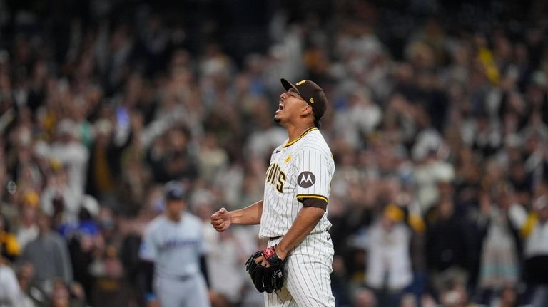 San Diego Padres relief pitcher Jeremiah Estrada celebrates after the...