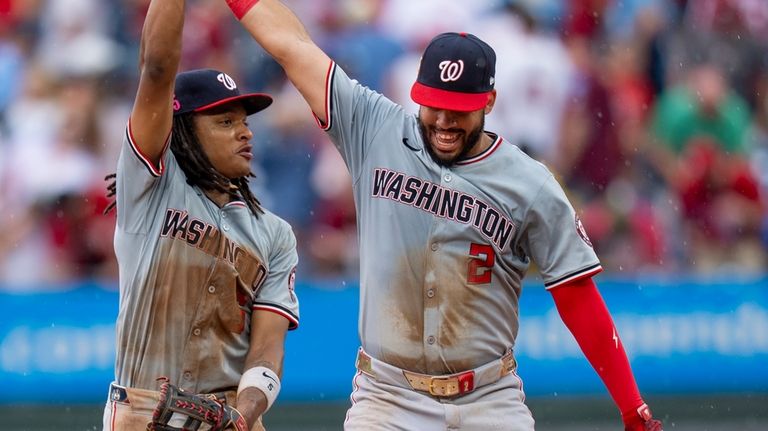 Washington Nationals shortstop C.J. Abrams, left, celebrates with second baseman...