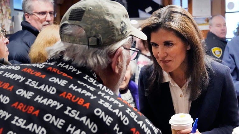 Republican presidential candidate former UN Ambassador Nikki Haley chats with...