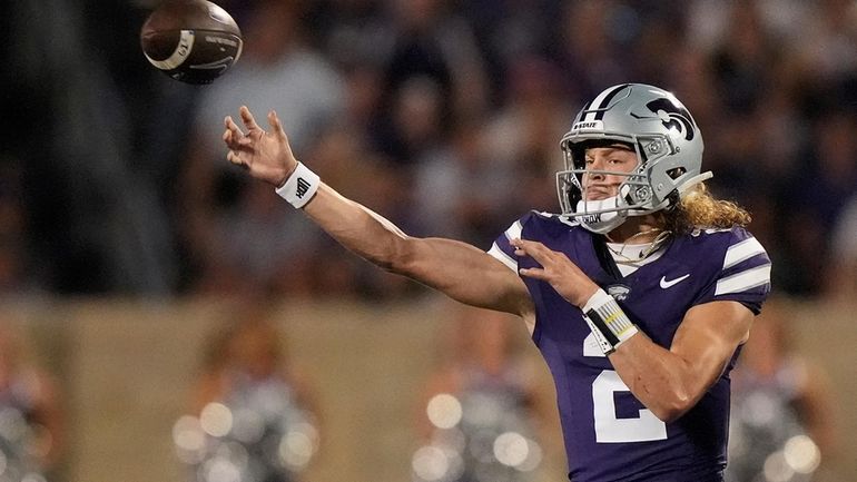 Kansas State quarterback Avery Johnson passes during the first half...