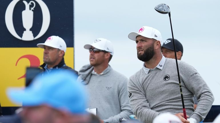 Jon Rahm of Spain watches his tee shot on the...