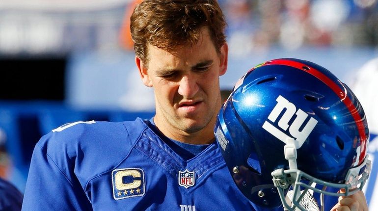 Eli Manning of the New York Giants looks on from...