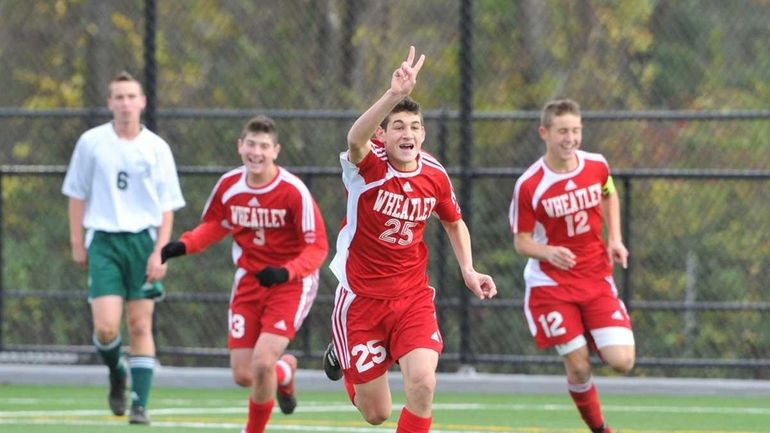 Wheatley junior Alex Butwin (25)reacts after his brother senior Jake...