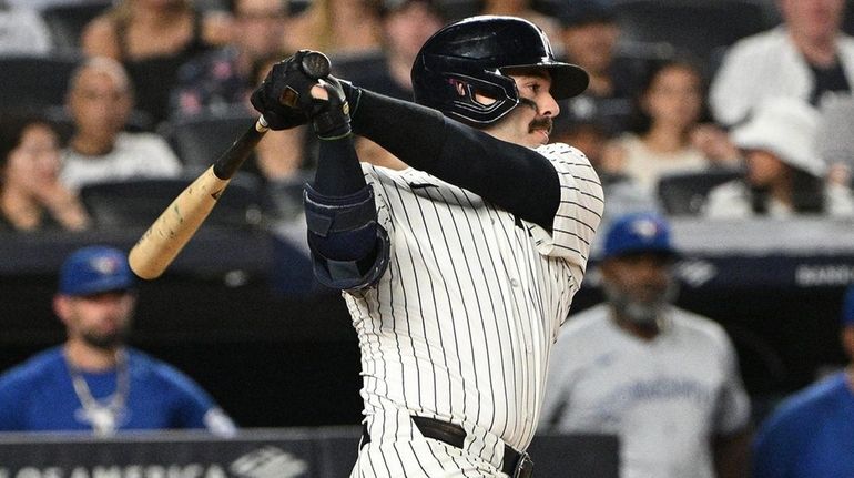 New York Yankees catcher Austin Wells singles against the Toronto...