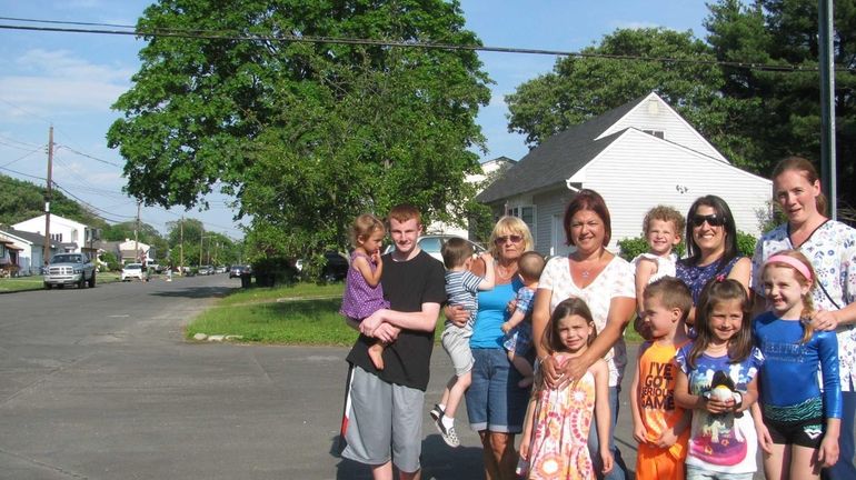 Jennifer Garcia, center, and neighbors on Silver Street in West...