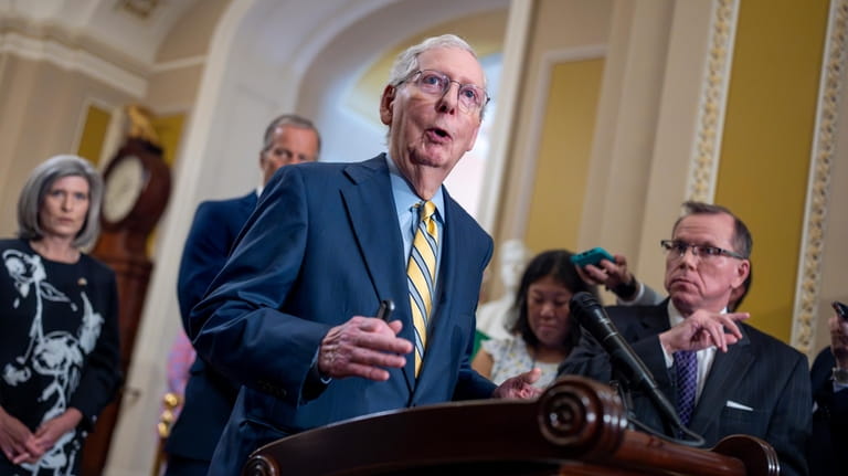 Senate Minority Leader Mitch McConnell, R-Ky., speaks to reporters following...