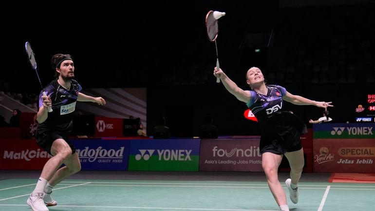 Denmark's Mathias Christiansen, left, and Alexandra Boje play mixed doubles...