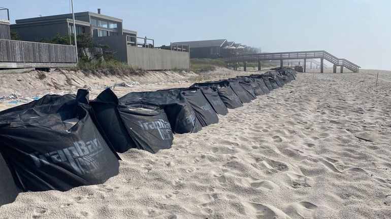 Sandbags are seen along the coastline at Fire Island Pines...