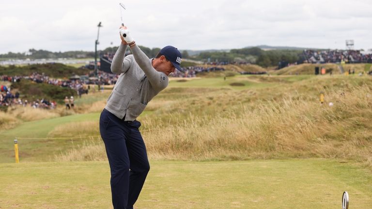 Billy Horschel of the United States hits off the seventh...