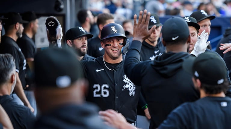 Chicago White Sox's Korey Lee (26) is congratulated after scoring...