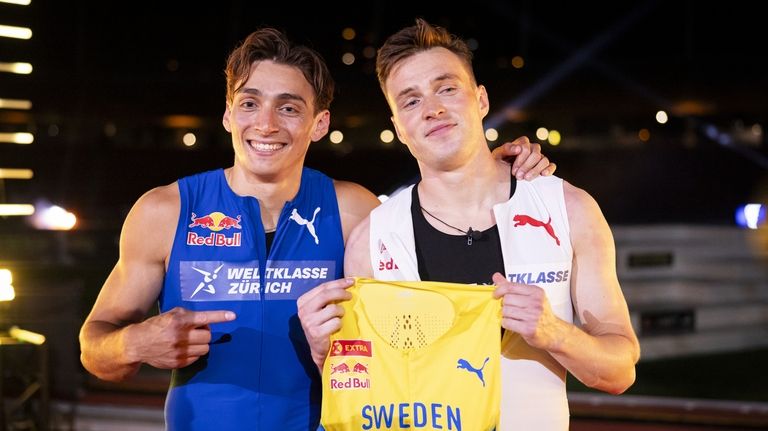 Armand Duplantis, left, of Sweden, and Karsten Warholm of Norway...