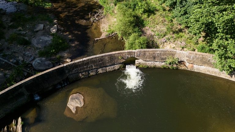 The Shulls Mill Dam is visible on the Watauga River,...