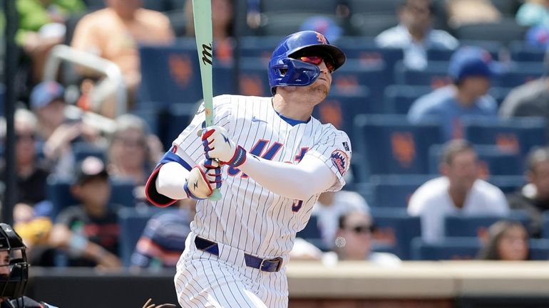 Brandon Nimmo #9 of the New York Mets follows through...