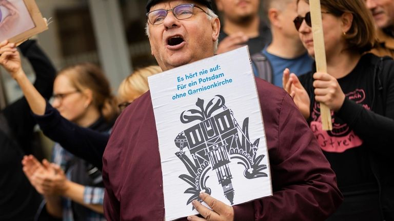 A participant in a protest organized by the "Citizens' Initiative...