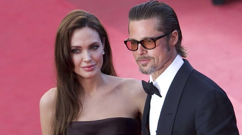 Angelina Jolie and Brad Pitt arrive for the screening of...