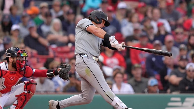 Chicago White Sox's Dominic Fletcher hits a one-run double in...