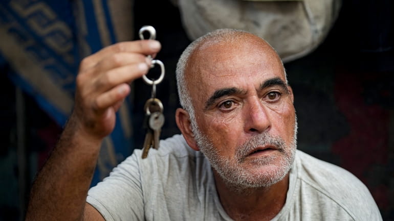 Hassan Nofal, 53, who was displaced by the Israeli bombardment...