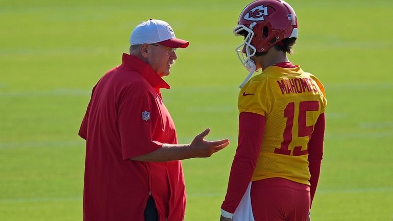 Kansas City Chiefs head coach Andy Reid talks to quarterback...