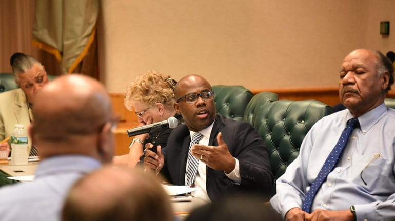 Jamal Scott, center, Uniondale assistant superintendent for business affairs, addresses...
