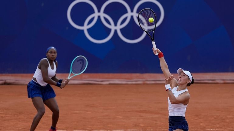 Coco Gauff and Jessica Pegula of the United States play...