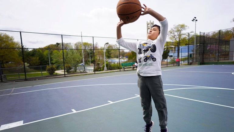 Aiden Hanifi, 8, of Roslyn enjoys time at Christopher Morley Park...