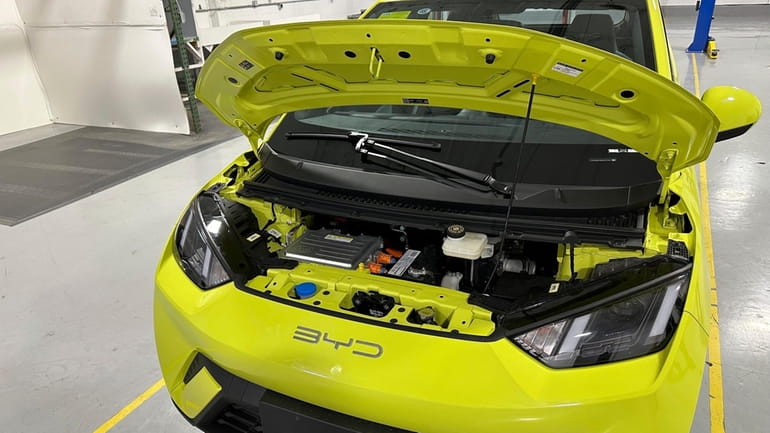 A BYD Seagull electric vehicle, with its hood open, is...