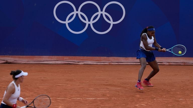 Coco Gauff and Jessica Pegula of the United States play...