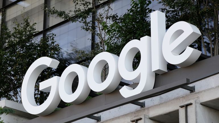 The Google sign is shown over an entrance to the...