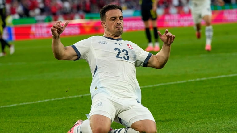Switzerland's Xherdan Shaqiri celebrates his side's equalising goal during a...