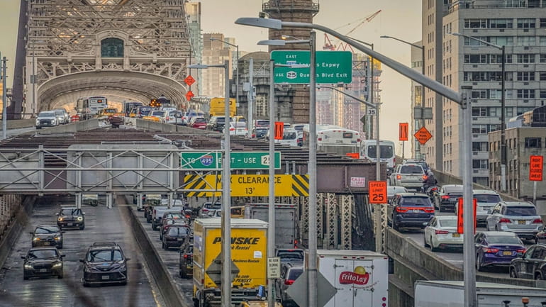 Traffic enter and leave mid-town Manhattan via the Queensboro Bridge,...