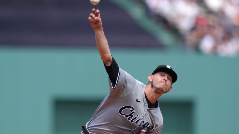 Chicago White Sox's Chris Flexen delivers a pitch to a...