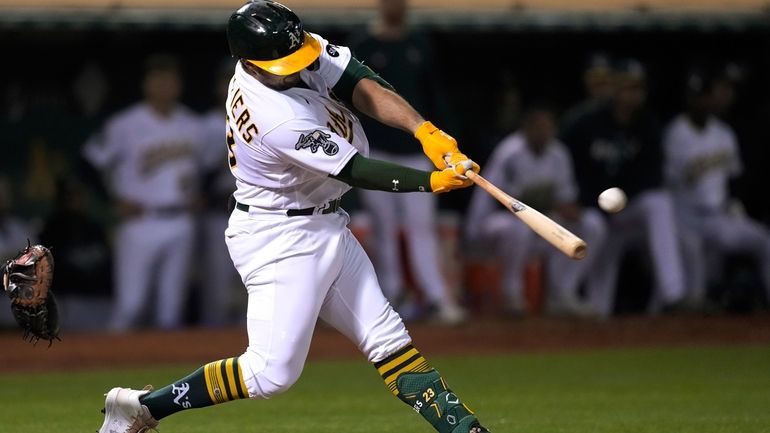 Oakland Athletics' Shea Langeliers hits a three-run home run against...