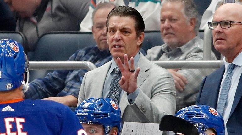 Head coach Lane Lambert of the Islanders reacts on the...