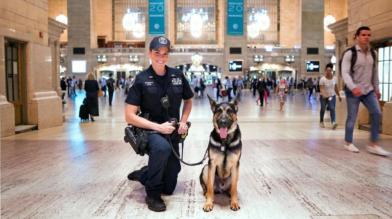 MTA Police Officer Alison Schmitt with her partner, Canine Mac,...