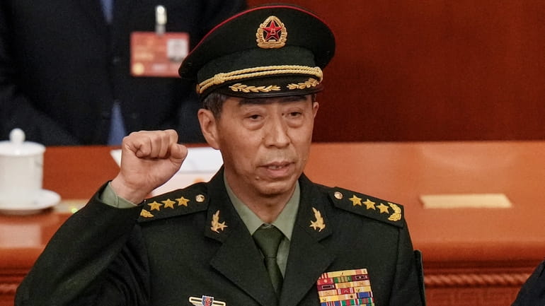 Newly elected Chinese Defense Minister Gen. Li Shangfu takes his...