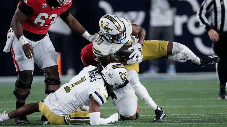 Georgia Tech defensive back Kenan Johnson (10) recovers a Georgia...