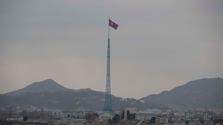 A North Korean flag flutters in North Korea's village Gijungdong,...