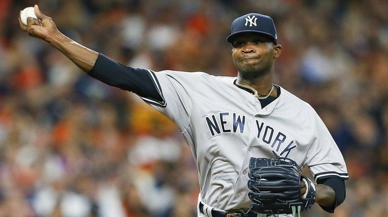 Domingo German of the Yankees pitches in the second inning...