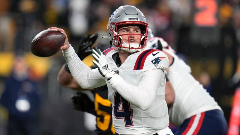 New England Patriots quarterback Bailey Zappe throws during the first...