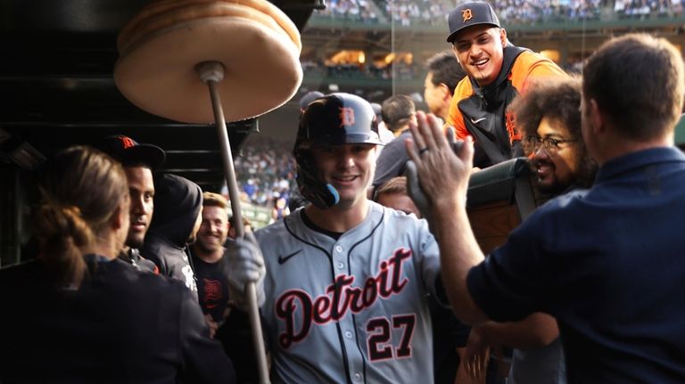 Detroit Tigers' Trey Sweeney celebrates after hitting a homer run...