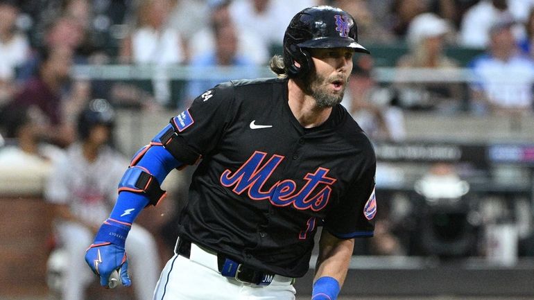 Mets rightfielder Jeff McNeil runs on his double against Atlanta...