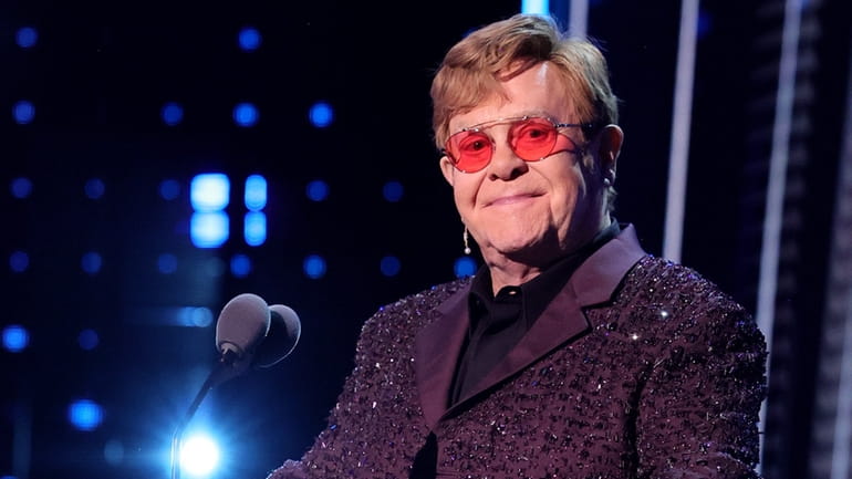 Elton John speaks onstage at the Rock & Roll Hall...